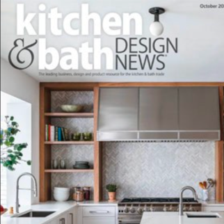 Magazine cover featuring a modern kitchen with a stainless steel range hood, open wooden shelves, and white countertops—showcasing the work of an Interior Designer Massachusetts. 