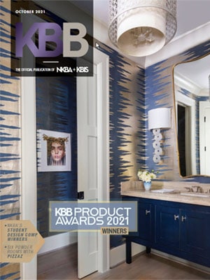 Cover of KBB Magazine, October 2021, featuring a modern bathroom with blue and gold patterned wallpaper, a round mirror, and a blue vanity—showcasing Luxury Interior Design. Text highlights KBB Product Awards 2021 winners.