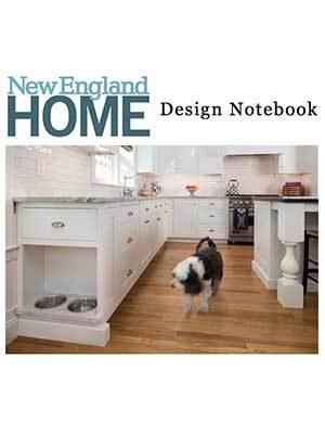 A dog walks on a wooden floor in a modern white kitchen with built-in pet food bowls, showcasing luxury interior design. Text at the top reads 